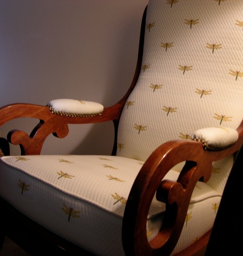Rocker upholstered with a new fabric with small dragonflies.